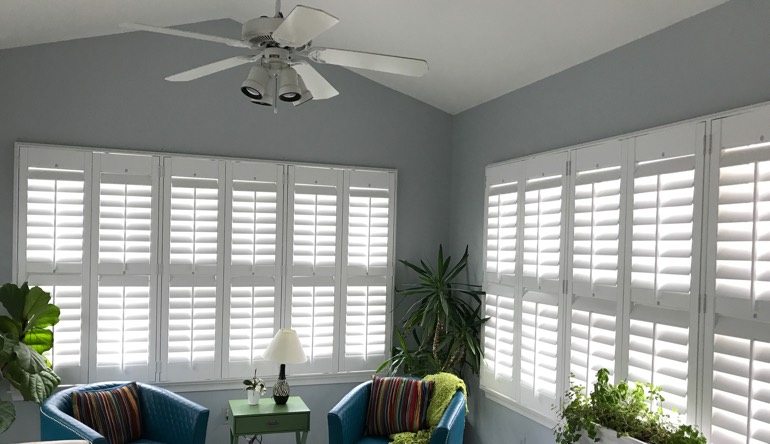 Gainesville sunroom with fan and shutters